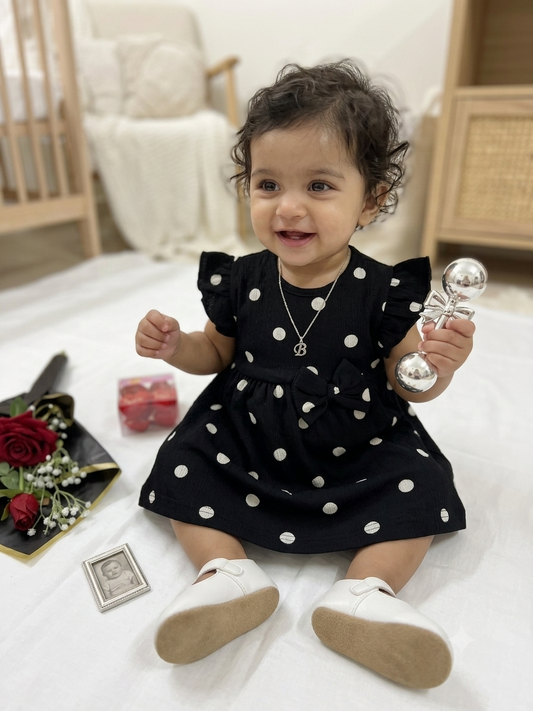 This adorable black polka dot dress